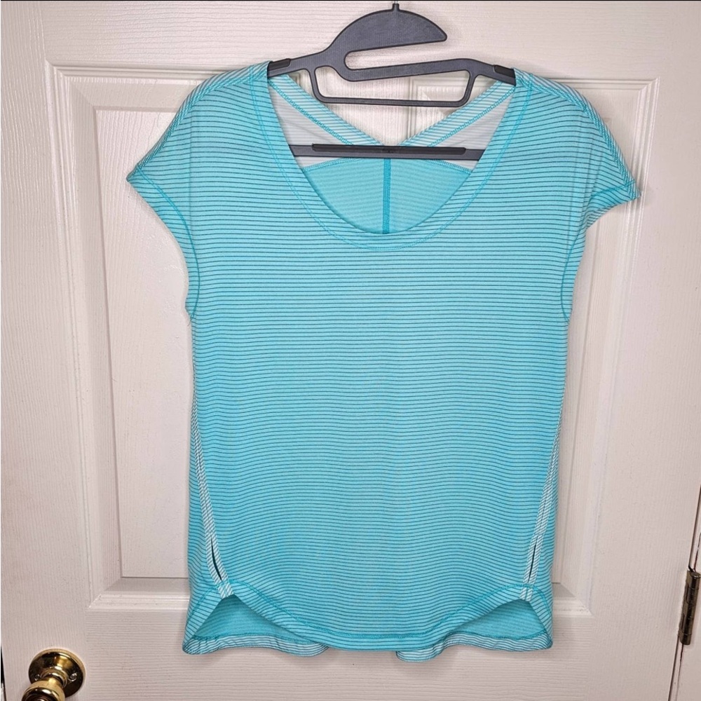Lululemon Short Sleeve T.  Curved hem and holes on sides. Size 6